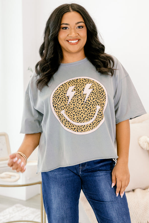 Chic Soul plus size clothing, grey vintage wash short sleeve slightly cropped tee with leopard print smiley face on the front with pink outline and lightning bolts as the eyes