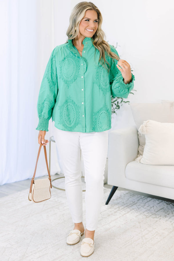 Plus size kelly green button-down top with tonal embroidery, ruffle collar, and smocked cuffs.