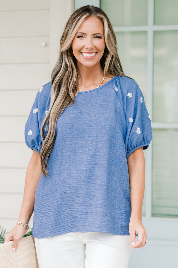 Chic Soul plus size clothing, short sleeve blue top with puff sleeves with white small floral emblems on sleeves
