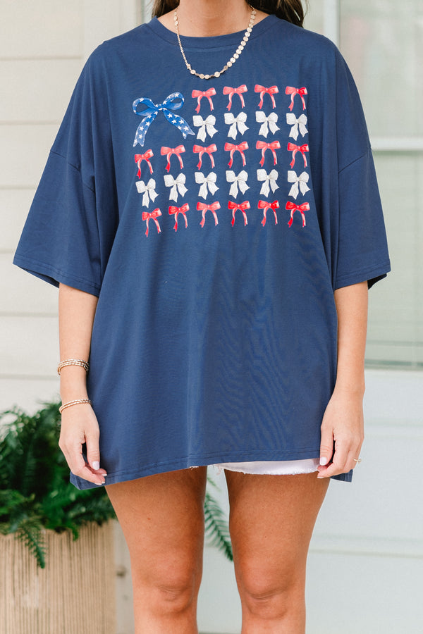 Chic Soul plus size clothing, navy blue short sleeve graphic tee with a flag symbol in the middle made out of bows