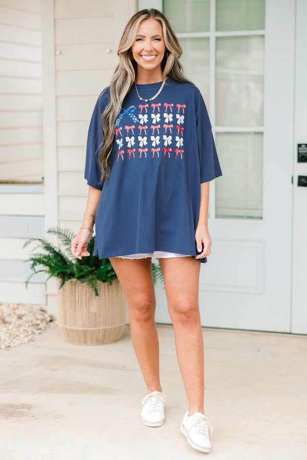 Chic Soul plus size clothing, navy blue short sleeve graphic tee with a flag symbol in the middle made out of bows