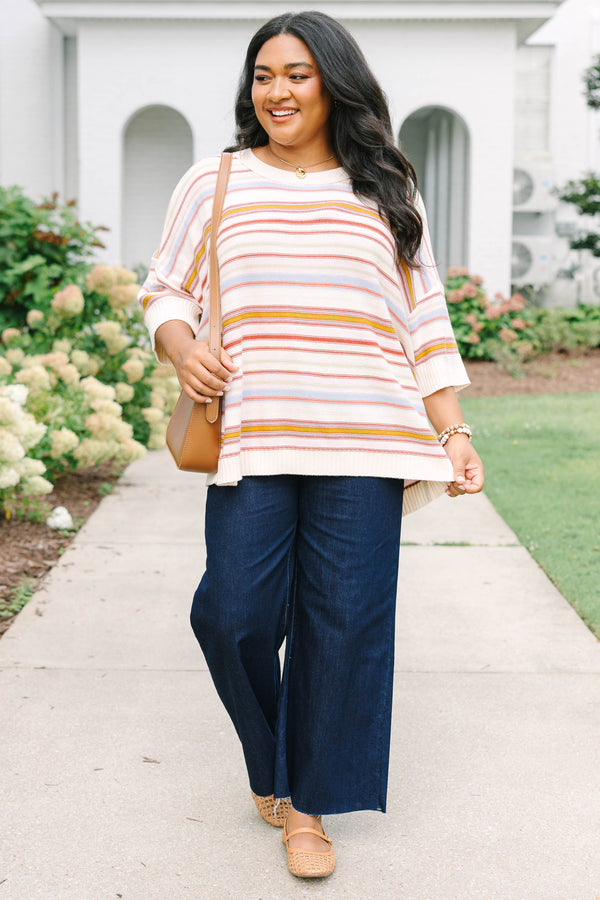 Plus size dusty rose striped sweater with a relaxed fit, drop shoulders, and short sleeves.