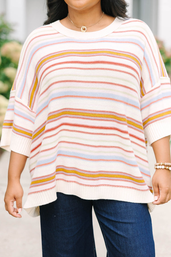 Plus size dusty rose striped sweater with a relaxed fit, drop shoulders, and short sleeves.