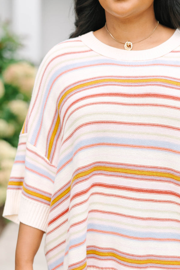 Plus size dusty rose striped sweater with a relaxed fit, drop shoulders, and short sleeves.