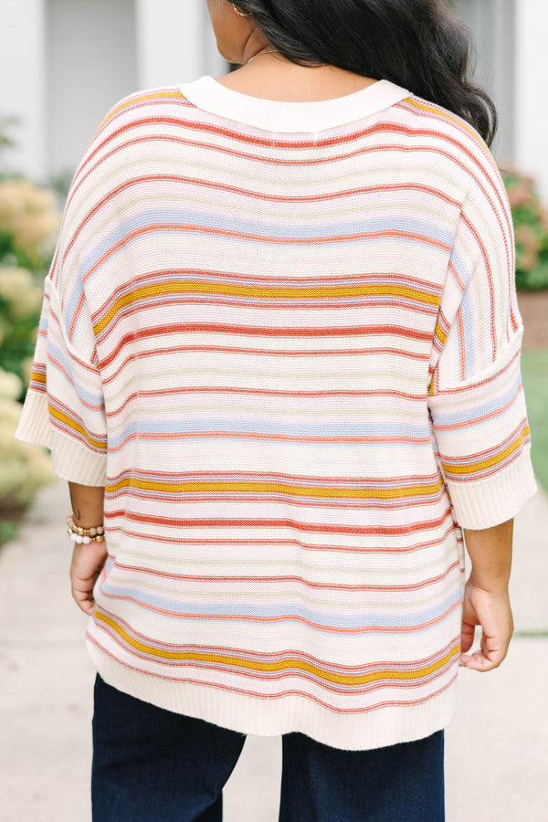 Plus size dusty rose striped sweater with a relaxed fit, drop shoulders, and short sleeves.