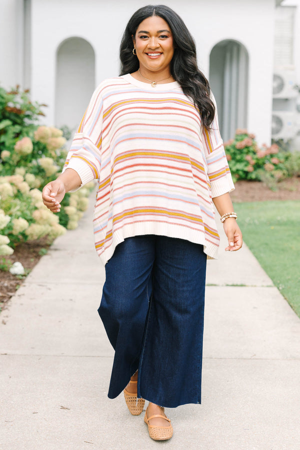 Plus size dusty rose striped sweater with a relaxed fit, drop shoulders, and short sleeves.