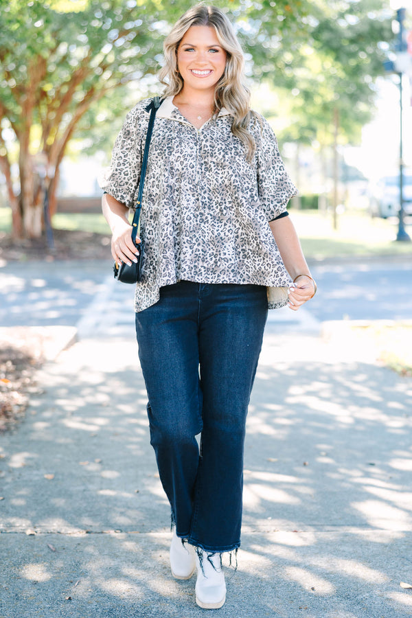 Plus Size leopard print quarter-zip top with short sleeves and a relaxed fit.