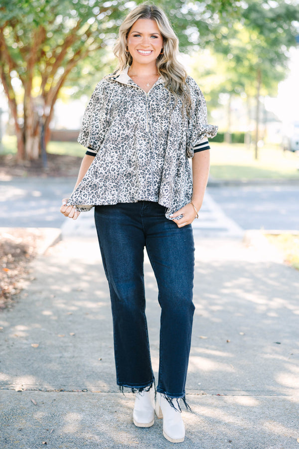 Plus Size leopard print quarter-zip top with short sleeves and a relaxed fit.