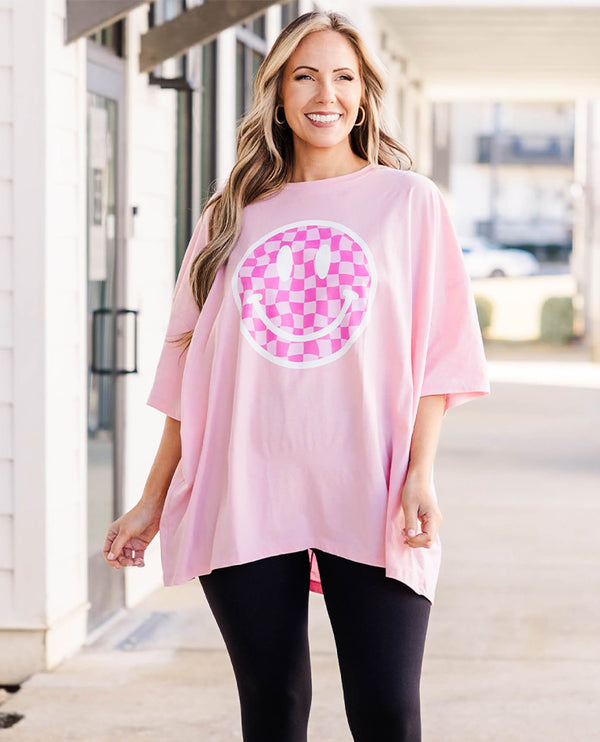 Plus Size dusty pink oversized boyfriend tee with a checkered smiley face graphic and crew neck.