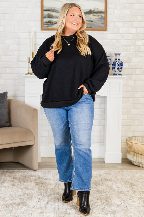 Plus Size black long sleeve top with drop shoulders, ribbed crew neck, cuffs, and banded hem.
