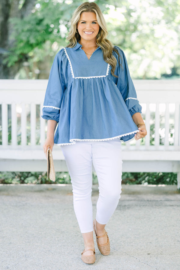 Plus size chambray top with white ric-rac trim, flowy babydoll fit, and 3/4 puff sleeves.