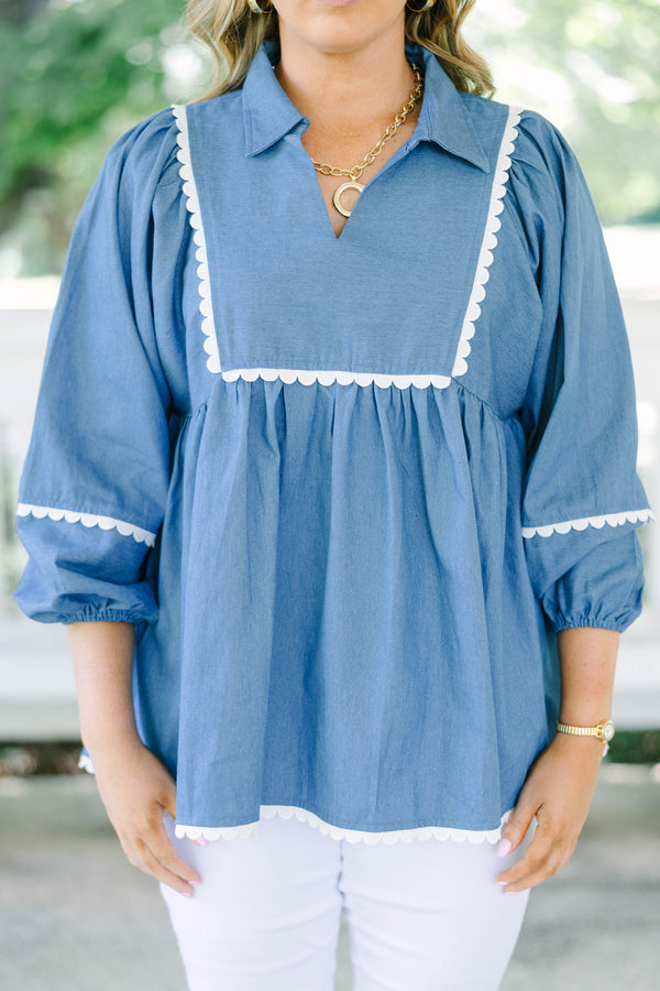 Plus size chambray top with white ric-rac trim, flowy babydoll fit, and 3/4 puff sleeves.