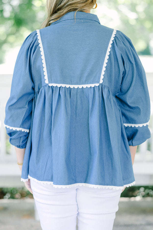 Plus size chambray top with white ric-rac trim, flowy babydoll fit, and 3/4 puff sleeves.