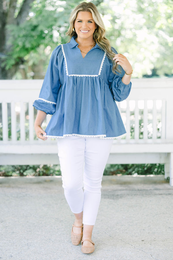 Plus size chambray top with white ric-rac trim, flowy babydoll fit, and 3/4 puff sleeves.