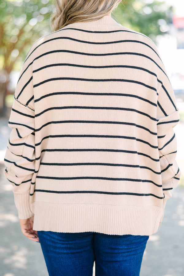 Plus size khaki and black striped knit sweater with a relaxed fit and ribbed crew neckline.