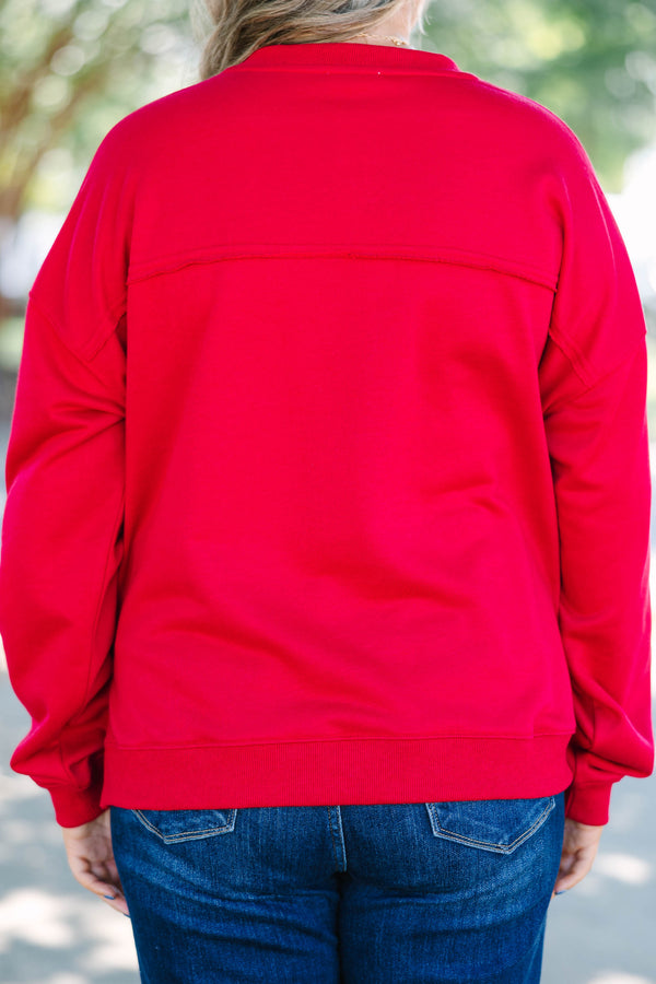 Plus Size crimson tunic sweatshirt with a split v-neckline, dropped shoulders, and raw seam details.