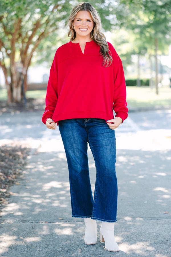 Plus Size crimson tunic sweatshirt with a split v-neckline, dropped shoulders, and raw seam details.