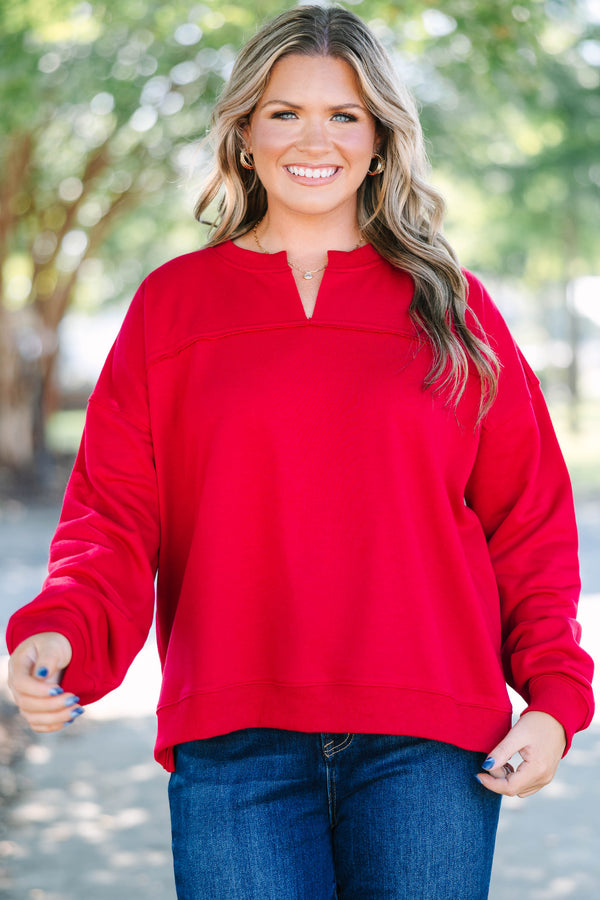 Plus Size crimson tunic sweatshirt with a split v-neckline, dropped shoulders, and raw seam details.