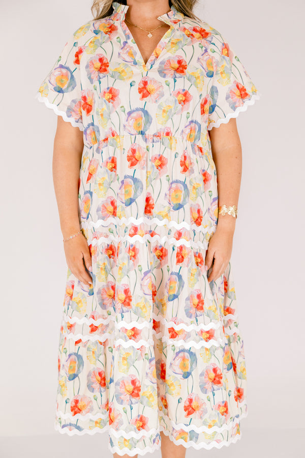 Chic Soul plus size clothing, cream tiered maxi dress with short sleeves and white scalloped details on each tier and at the bottom of the sleeves as well a a multi-color floral abstract pattern and a v-neckline 