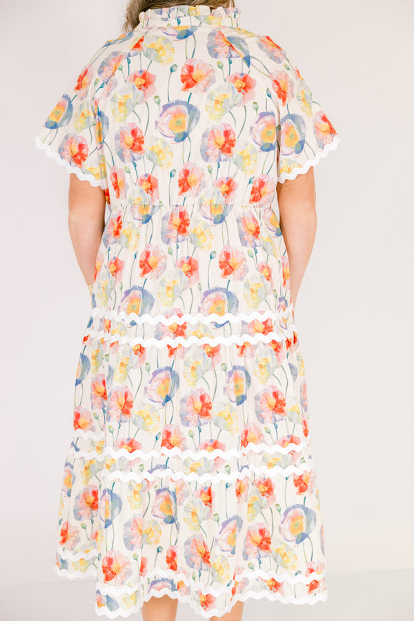 Chic Soul plus size clothing, cream tiered maxi dress with short sleeves and white scalloped details on each tier and at the bottom of the sleeves as well a a multi-color floral abstract pattern and a v-neckline 