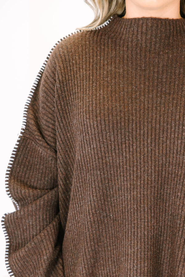 Plus Size brown ribbed knit sweater with a high neckline and white whipstitch trim on the sleeves.