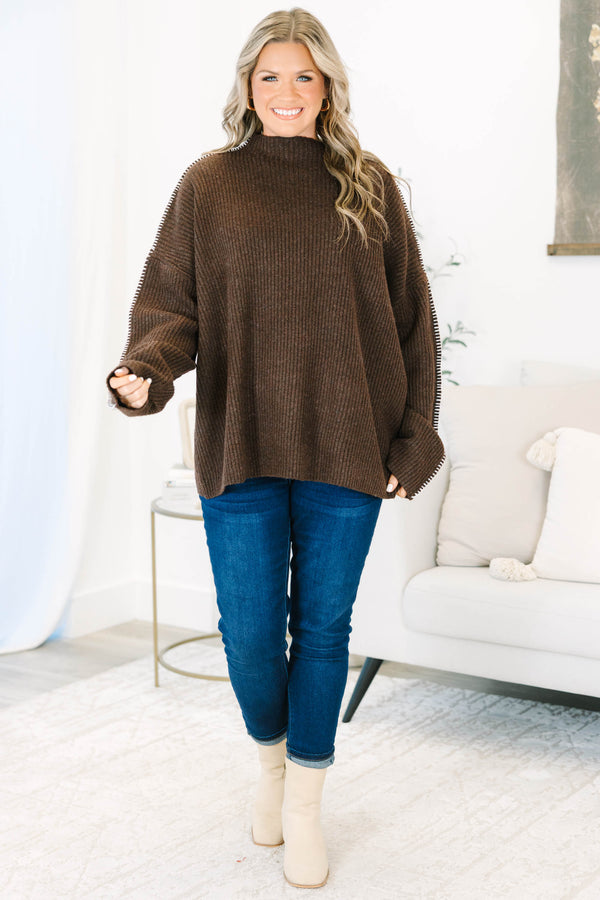 Plus Size brown ribbed knit sweater with a high neckline and white whipstitch trim on the sleeves.