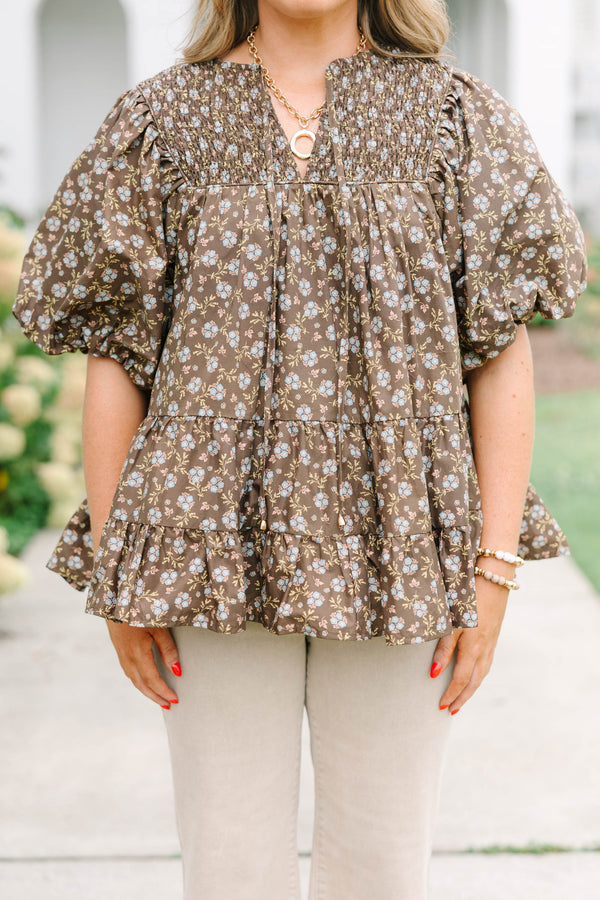 Plus Size brown floral babydoll top with smocked split v-neck, tassels, and elastic puff sleeves.