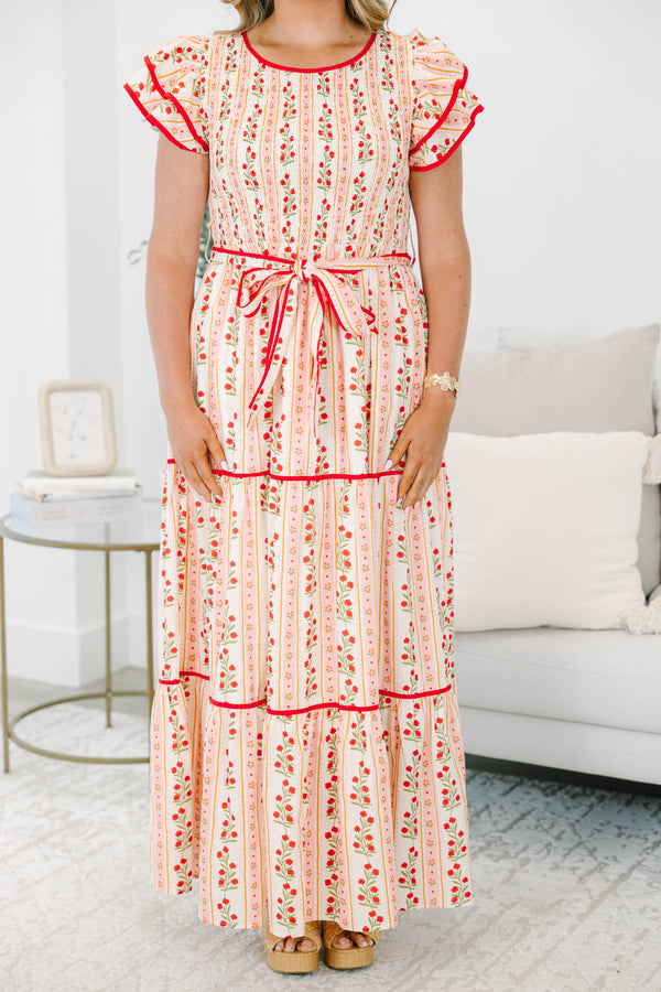 Plus size pink floral maxi dress with smocked bodice, ruffle cap sleeves, and a tiered flowy skirt.