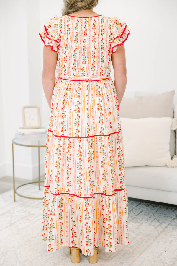 Plus size pink floral maxi dress with smocked bodice, ruffle cap sleeves, and a tiered flowy skirt.