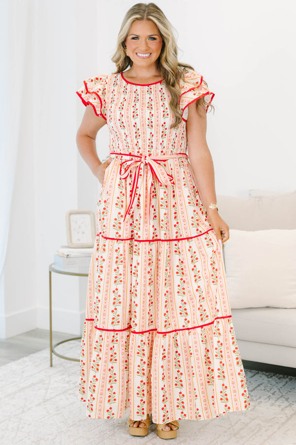 Plus size pink floral maxi dress with smocked bodice, ruffle cap sleeves, and a tiered flowy skirt.