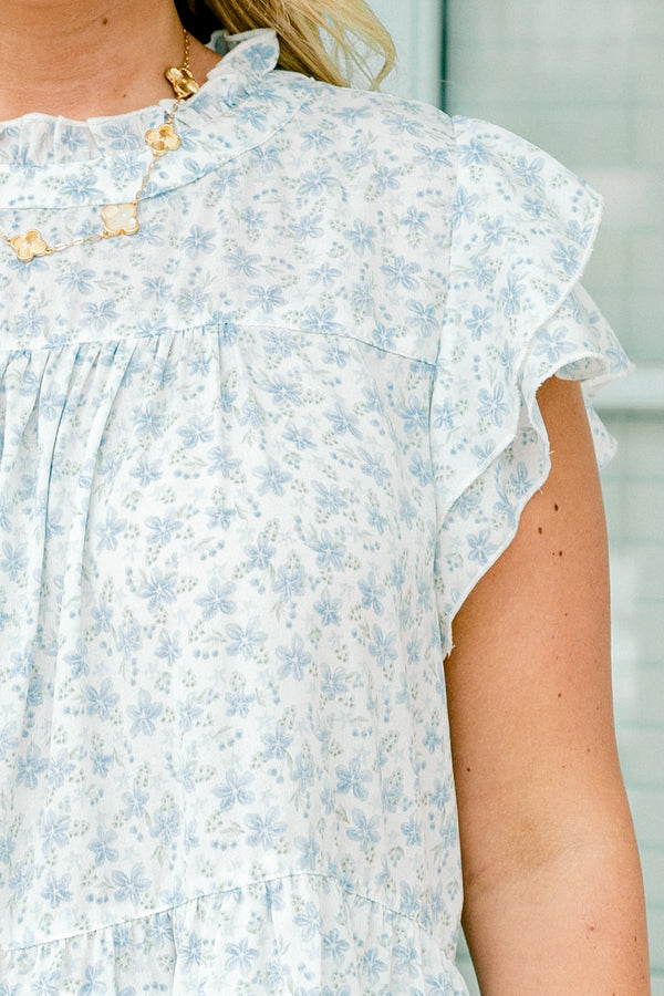 Chic Soul plus size clothing, short-flutter-sleeve blue and white floral top with a ruffled mock neck and a subtle ruffled tier