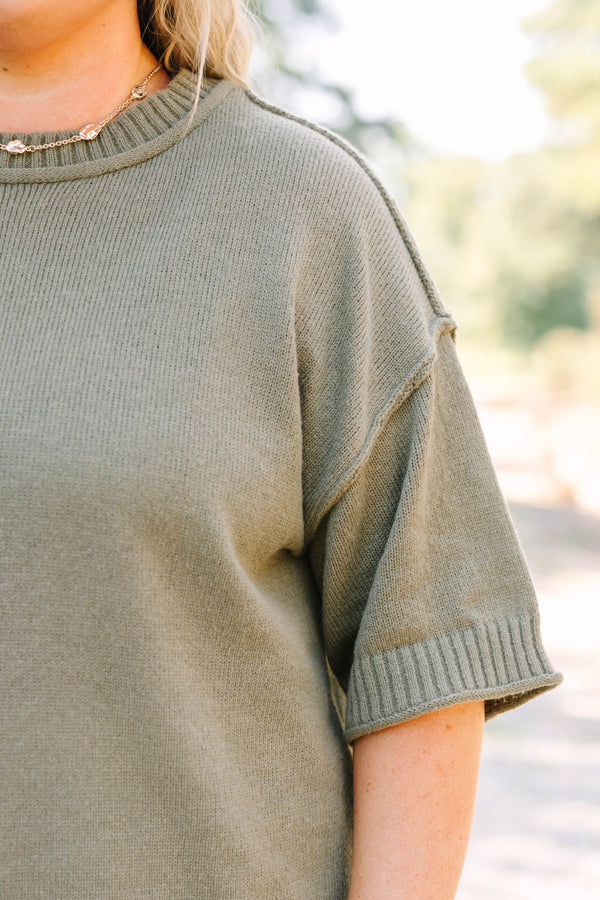 Plus Size olive green knit sweater with a crew neckline and elbow-length sleeves.