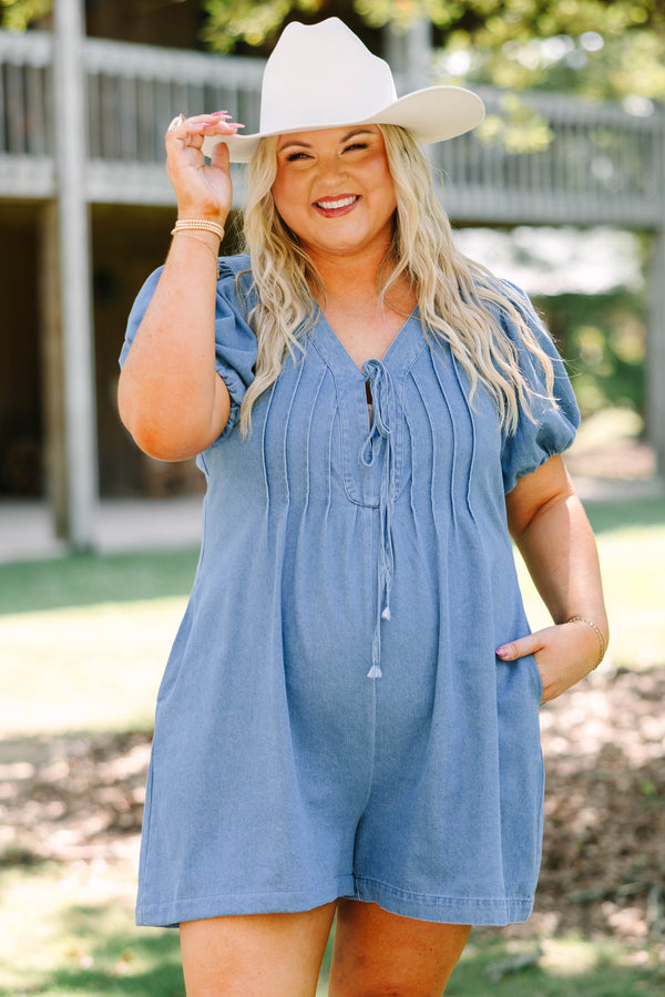 Plus Size denim romper with puff sleeves, a tie-front V-neckline, and pleated bodice details.