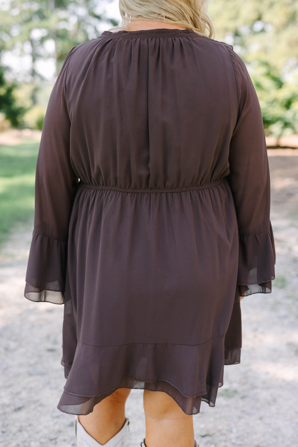 Plus Size brown long sleeve dress with a ruffled V-neckline, tiered skirt, and bell sleeves.