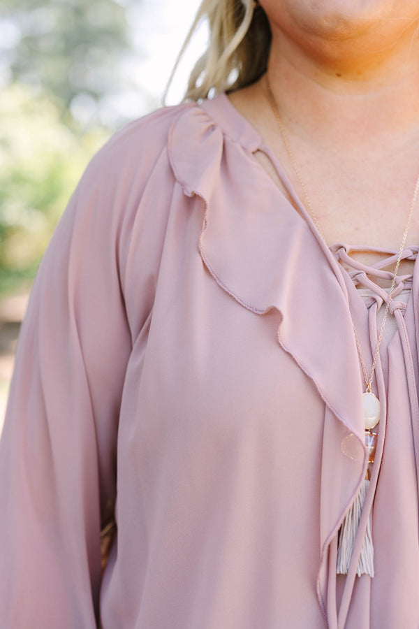 Plus Size dusty pink long sleeve top with ruffle details, a lace-up neckline, and tiered sleeves.