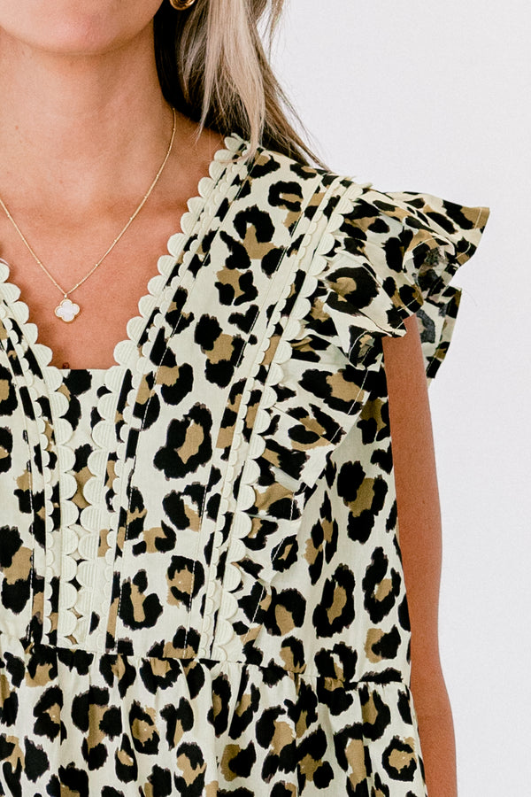 Chic Soul Plus size clothing, leopard peplum top with flutter sleeves and white scalloped detail on the v-neckline 
