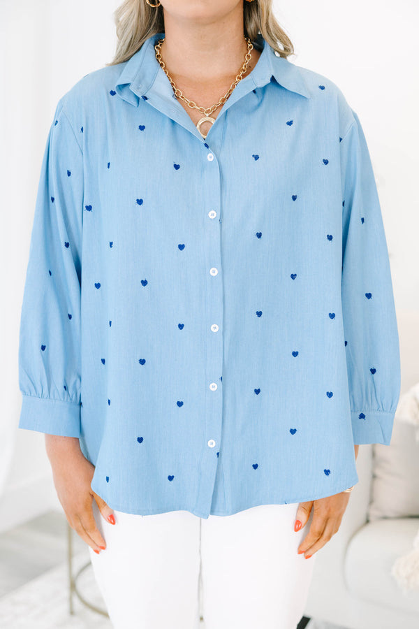 Plus Size light wash denim button-down shirt with dark blue heart embroidery and long sleeves.