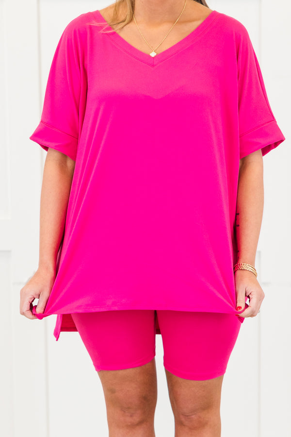 Plus Size neon hot pink set with a v-neck short sleeve tunic top and matching biker shorts.