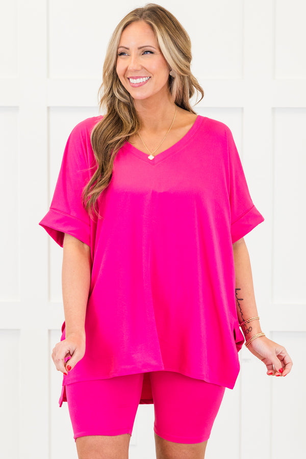 Plus Size neon hot pink set with a v-neck short sleeve tunic top and matching biker shorts.