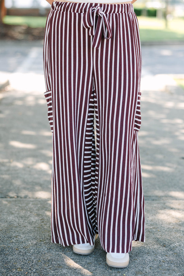 Plus size Be A Better You brown and white vertical stripe wide leg pants with a tie waist.