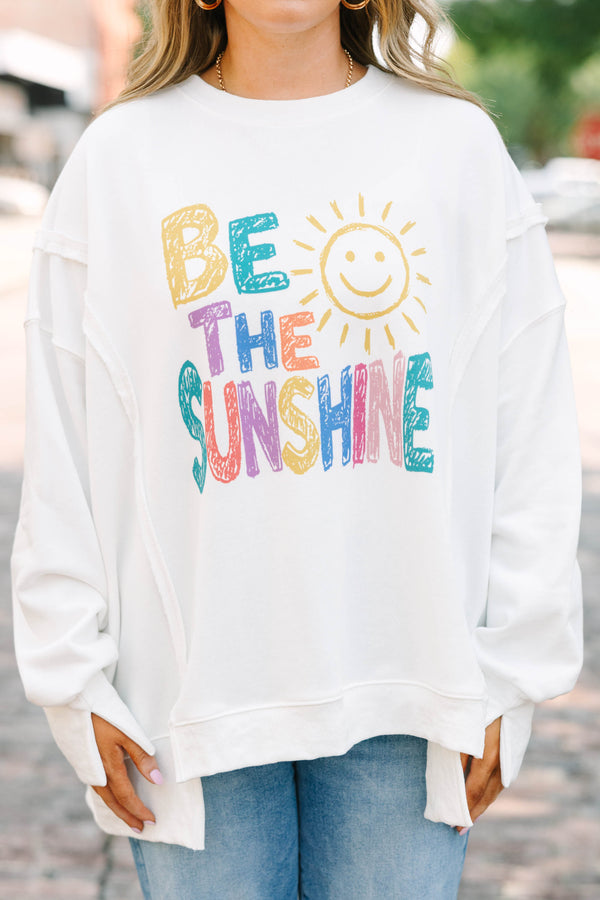 Plus size ivory crew neck pullover with colorful 'be the sunshine' graphic