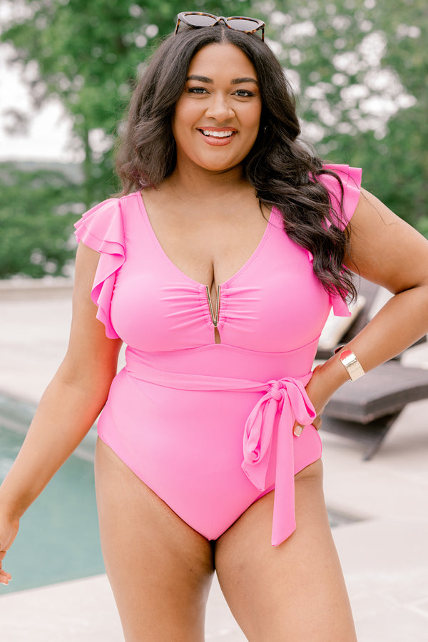 Chic Soul Plus Size Clothing, a pink swimsuit with a gold V detail at center bust, ruffle sleeves, and a bow belt detail