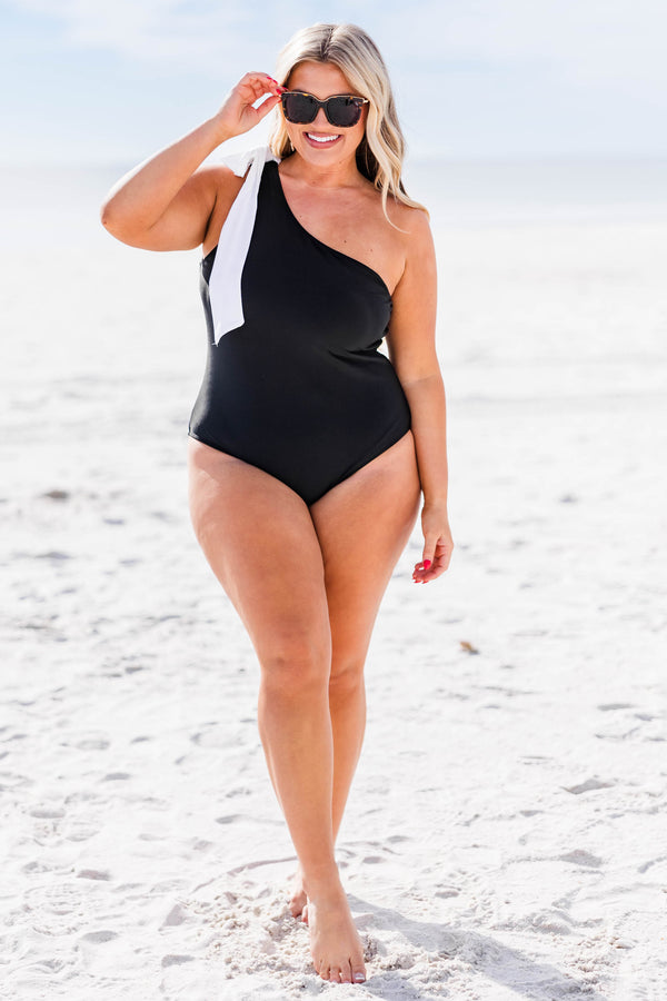 Chic Soul plus size clothing, black one shoulder one piece swimsuit with white bow tie at the top of the strap
