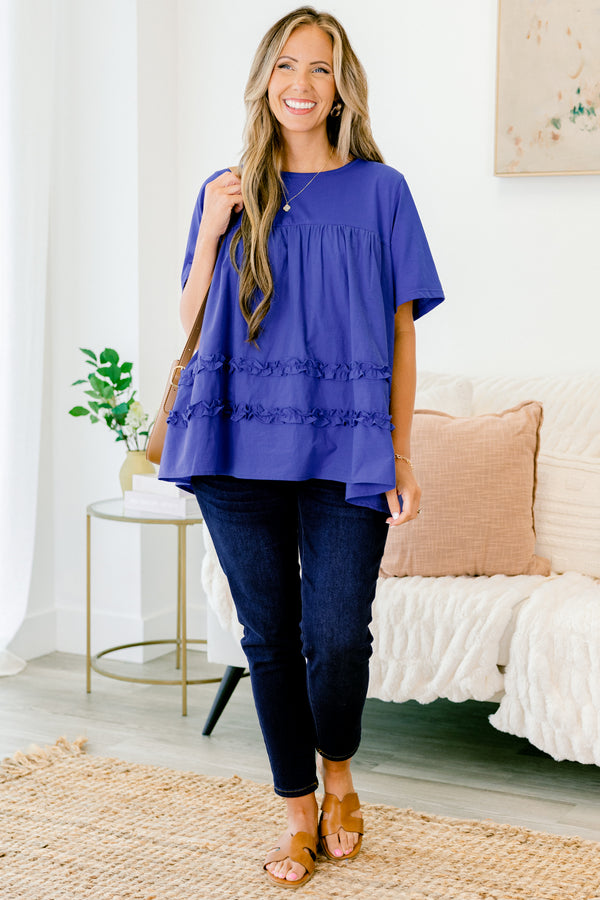 Chic Soul Plus size clothing, blue short sleeve blouse with ruffle detailing the bottom of the shirt 
