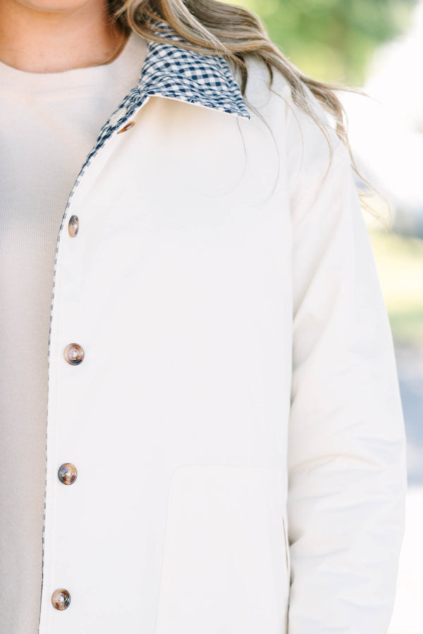 Plus size navy gingham reversible quilted coat with a taupe lining and button front.