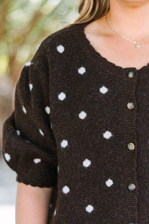 Plus Size brown cardigan with white polka dots, short puff sleeves, and a button-front closure.