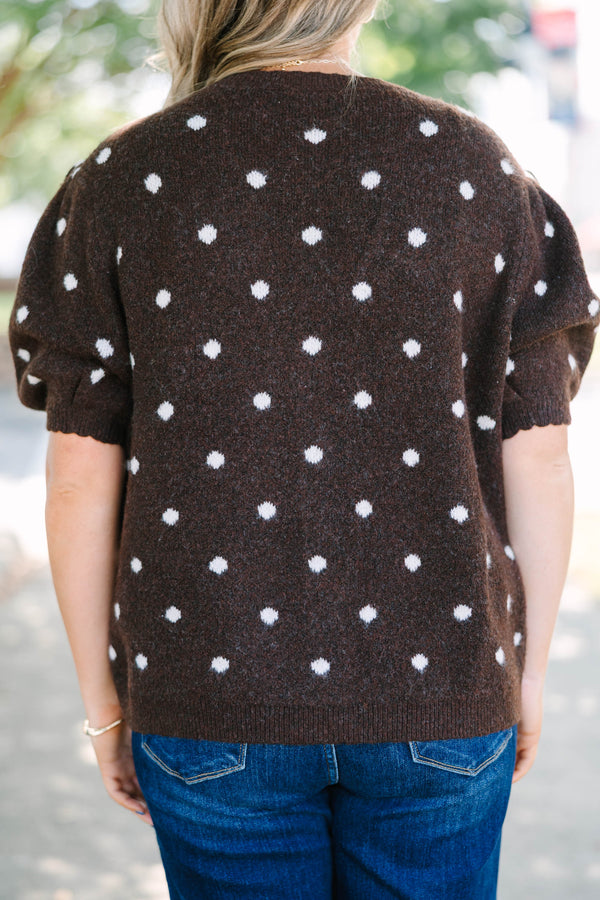 Plus Size brown cardigan with white polka dots, short puff sleeves, and a button-front closure.