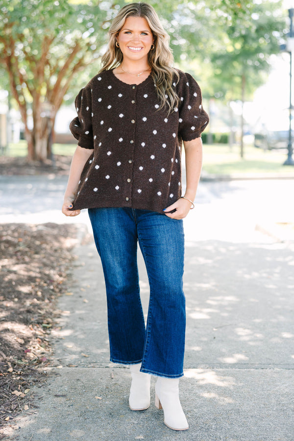 Plus Size brown cardigan with white polka dots, short puff sleeves, and a button-front closure.