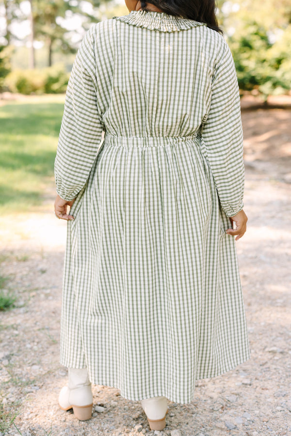 Plus size green and white plaid midi dress with a smocked waist, ruffle neckline, and flowy fit.
