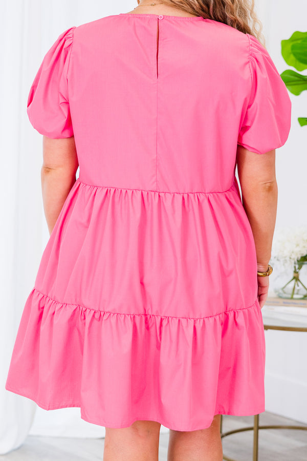 Plus Size pink tiered babydoll dress with a bow-detailed v-neckline and bubble sleeves.
